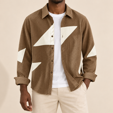 Model wearing a brown long-sleeve shirt with cream angular shapes