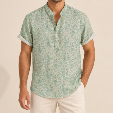 Model wearing a pale green short-sleeve band collar shirt with a fine repeating pattern