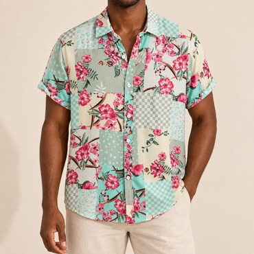 Model wearing a mint and pink floral patchwork short-sleeve shirt