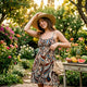 Woman in tropical outfit preparing for summer party
