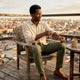 Man wearing linen shirt and chinos on rooftop