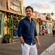 Man wearing white linen beach shirt at beach