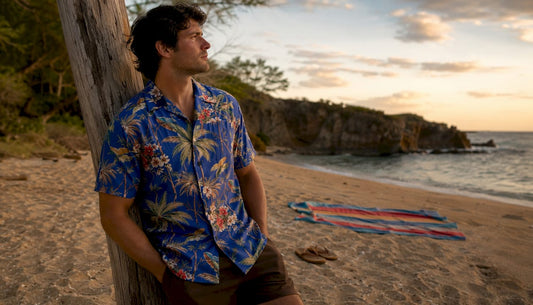 Man wearing cobalt blue Dan Flashes shirt on boardwalk
