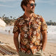 Man wearing Dan Flashes floral Hawaiian shirt on beach
