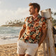 Man wearing Dan Flashes floral shirt on beach boardwalk