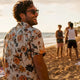 Man in floral Dan Flashes shirt at beach boardwalk