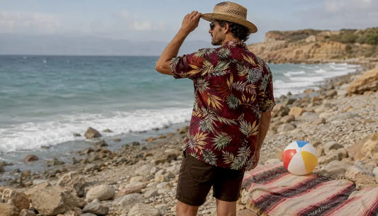 Man wearing Dan Flashes bold floral beach shirt