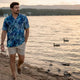 Man wearing Dan Flashes tropical shirt on beach