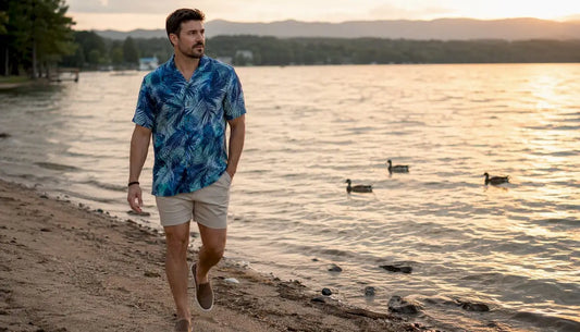 Man wearing Dan Flashes tropical shirt on beach