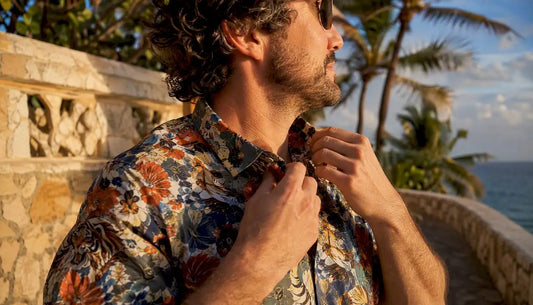 Man adjusting Danflashes Hawaiian shirt collar