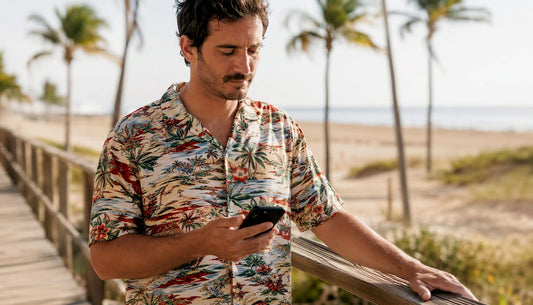 Man reading return policy on phone outdoors