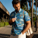 Man wearing Dan Flashes shirt on resort boardwalk