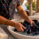 Man hand-washing a Dan Flashes cotton shirt