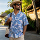 Man pairing Dan Flashes shirt with straw hat