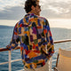 Man wearing colorful Dan Flashes shirt