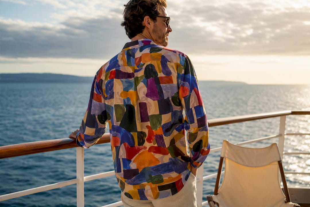 Man wearing colorful Dan Flashes shirt