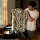 Man packing exact Hawaii vacation shirt