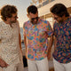 Groomsmen wearing colorful Dan Flashes shirts