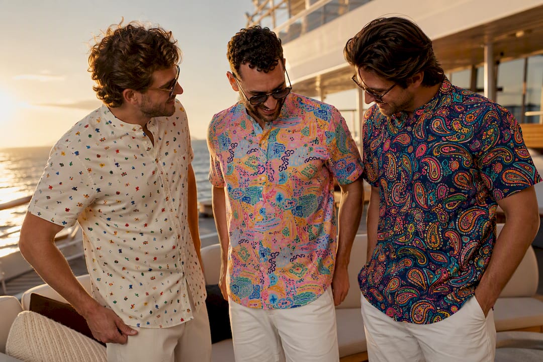 Groomsmen wearing colorful Dan Flashes shirts