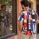 Man wearing abstract print band collar shirt