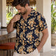 Man wearing floral camp collar shirt