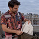 Man wearing a Dan Flashes shirt on a rooftop