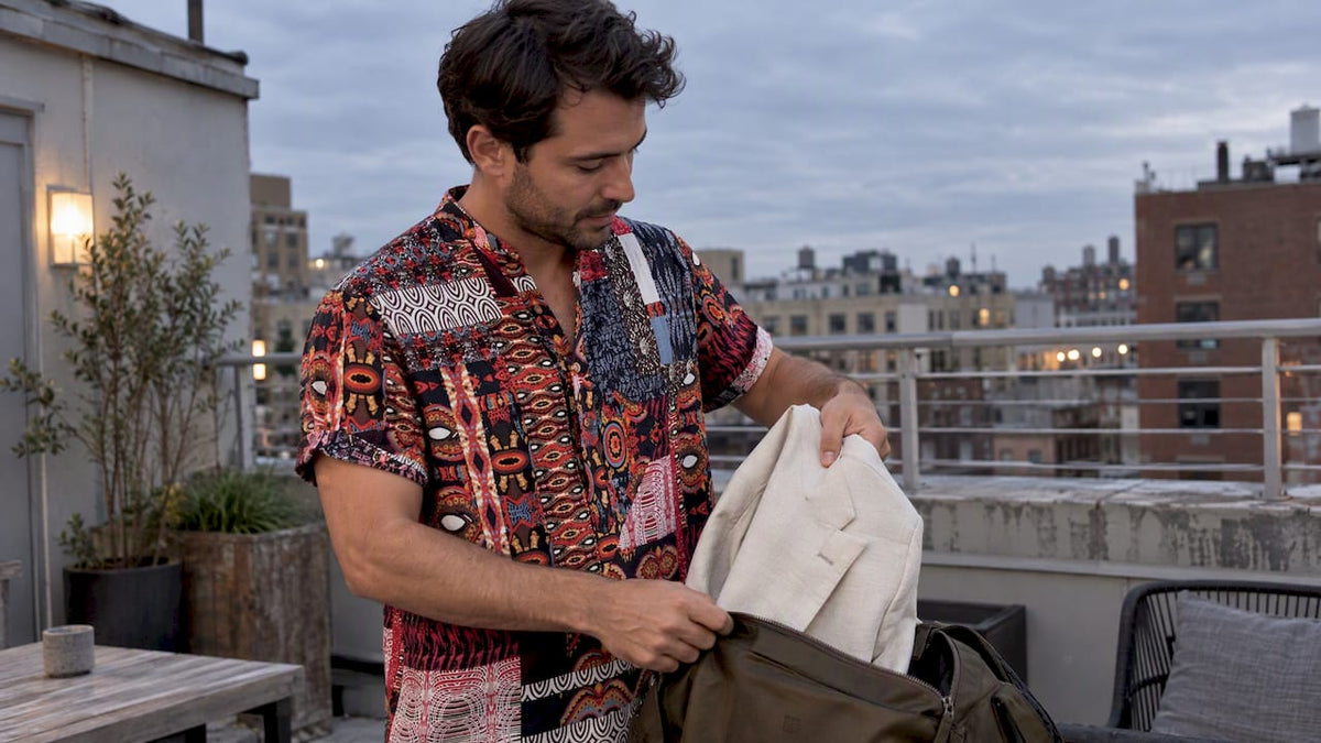 Man wearing a Dan Flashes shirt on a rooftop