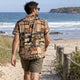 Man wearing a Dan Flashes shirt at the beach