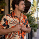 Man in bold shirt on Miami street