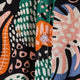 Close-up of a button-up shirt with pink, green, orange and blue abstract shapes
