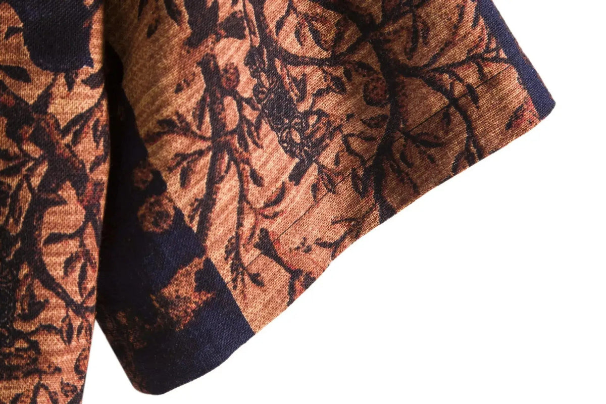 Close-up of an orange and dark floral shirt sleeve