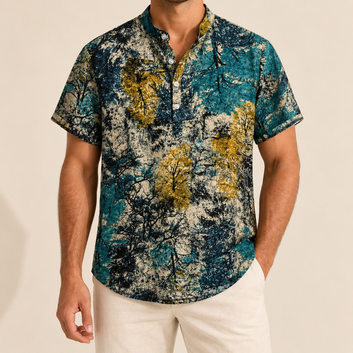 Model wearing a teal, gold and cream mottled-print short-sleeve band-collar shirt