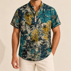 Model wearing a teal, gold and cream mottled-print short-sleeve band-collar shirt