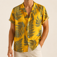 Man wearing a yellow leaf print Hawaiian shirt - Dan Flashes