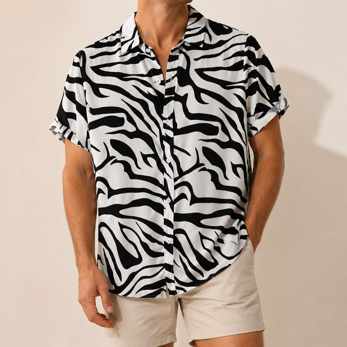 Man wearing a black and white zebra print short-sleeve shirt