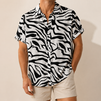 Man wearing a black and white zebra print shirt - Dan Flashes