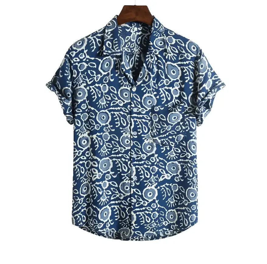Blue short-sleeve shirt with small pale outlined curls and rounded motifs