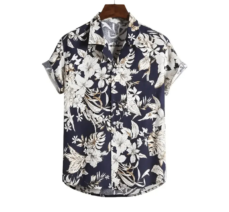 Dark Hawaiian shirt with dense pale botanical leaves and flowers