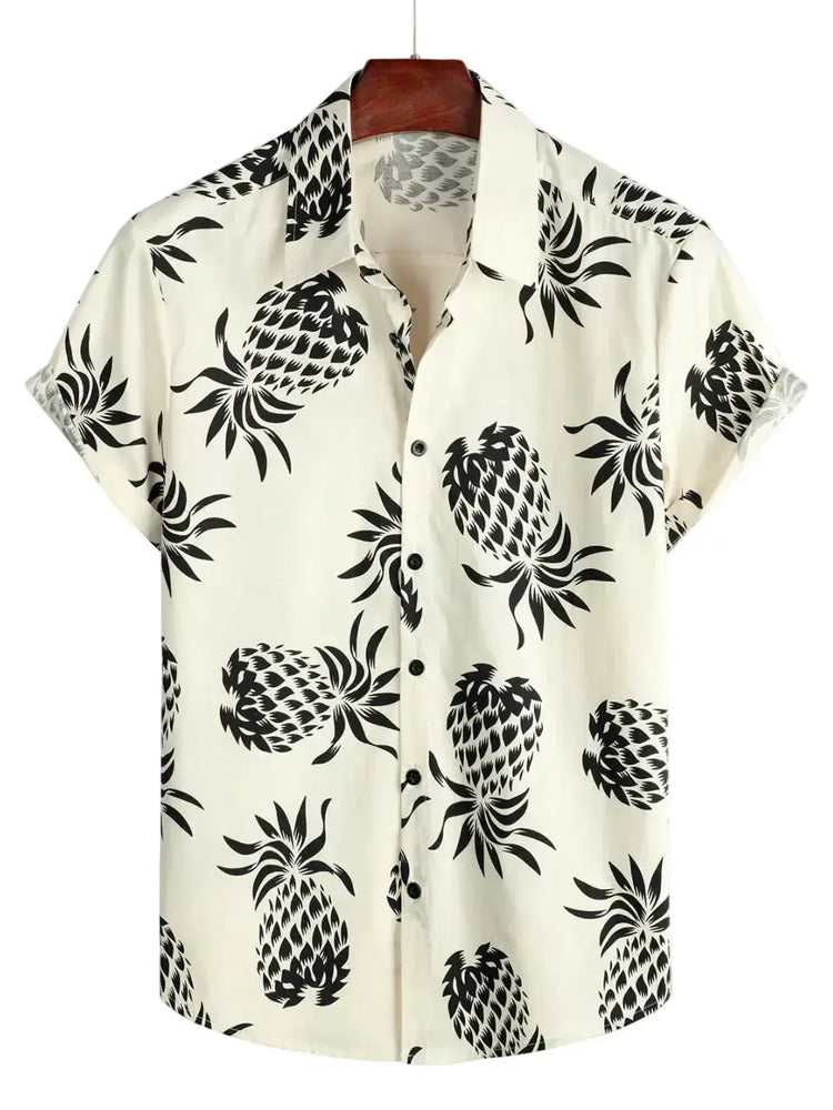 Pale short-sleeve shirt with large dark pineapple silhouettes