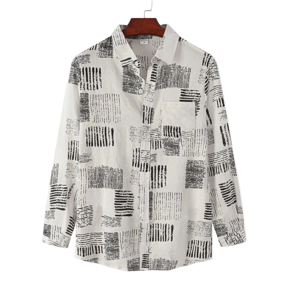 Pale long-sleeve button-up shirt with small dark rectangular marks