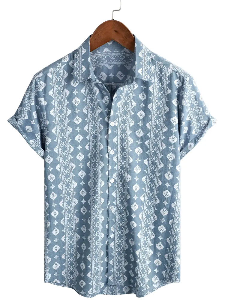 Blue short-sleeve shirt with vertical rows of pale geometric diamonds