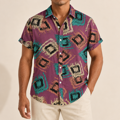 Model wearing a purple short-sleeve shirt with teal and tan abstract diamond motifs
