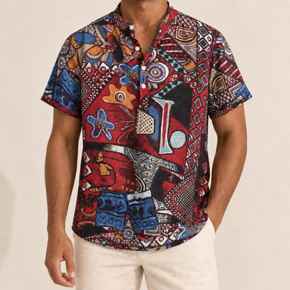 Model wearing a red and blue abstract medallion shirt with a band collar