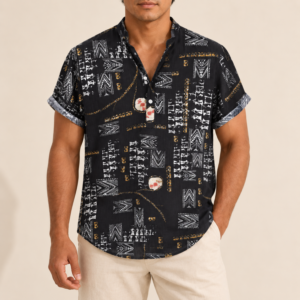 Model wearing a black short-sleeve band-collar shirt with white geometric motifs