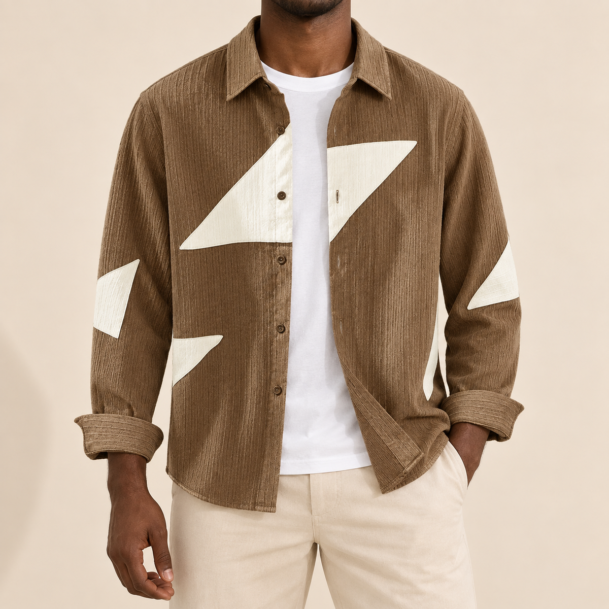 Model wearing a brown long-sleeve shirt with cream angular shapes