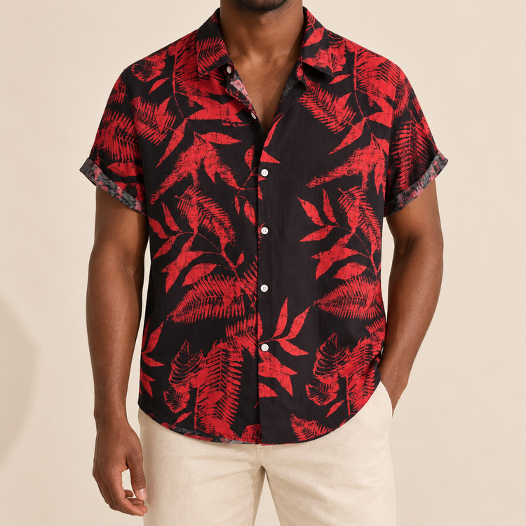 Model wearing a black short-sleeve shirt with red leaves