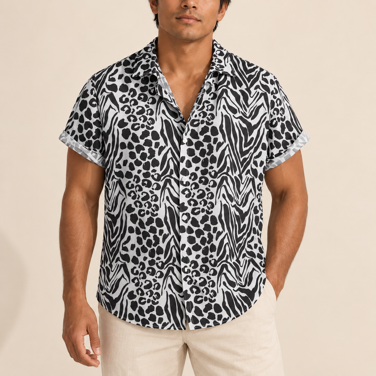 Model wearing black and white short-sleeve shirt with mixed animal spots and zebra markings