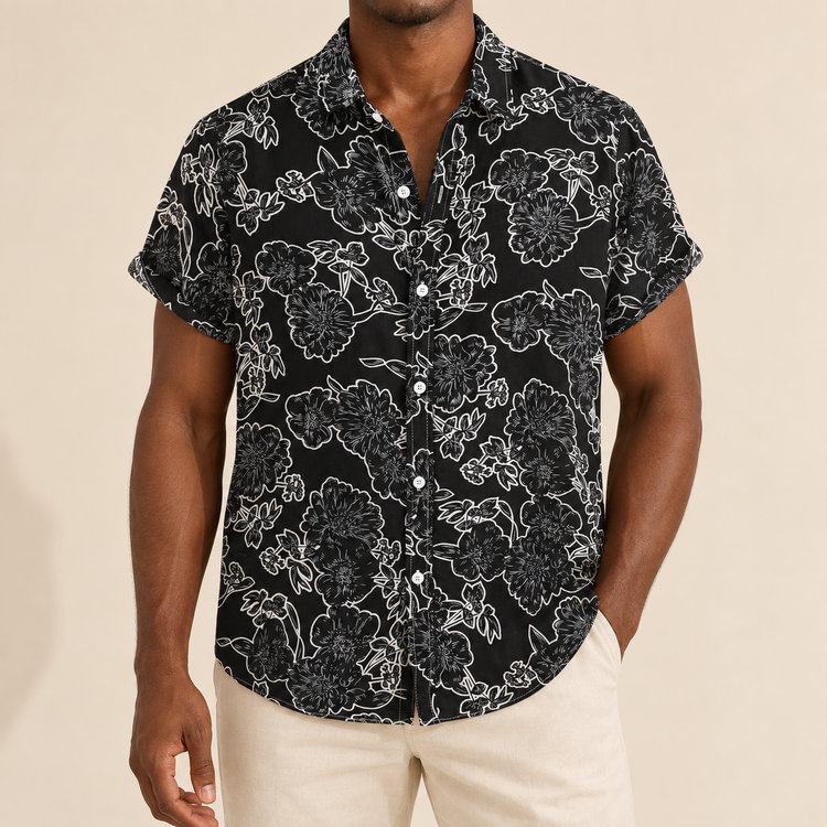 Model wearing a black short-sleeve shirt with white outline flowers