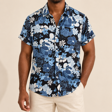 Model wearing a blue and white floral short-sleeve shirt