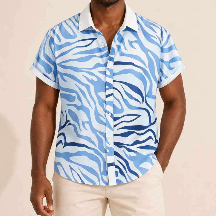 Model wearing white short-sleeve shirt with blue zebra-style stripes